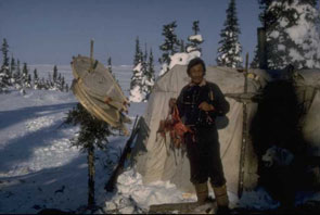 Sam Napeo holding caribou foetuses in his right hand at Kaushetinati. Photo courtesy Georg Henriksen.
