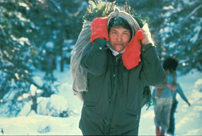 Katinen Pastitshi carrying fir boughs for the tent floor at Enakapeshakamau. Photo Nigel Markham, courtesy Innu Nation.