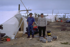 Hank Penashue and Pinip Nuna in front of Hank's tent at Kanakashkuaikanishit. Photo courtesy Peter Armitage.