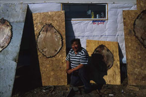 Puniss Nuke poses by his stretched beaver pelts at Ashuapamatikuan. Photo courtesy Peter Armitage.