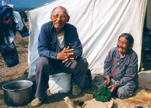 Tshishennish and Tenesh Pasteen in front of their tent at Kameshtashtan. Photo courtesy Gerry Pasteen.